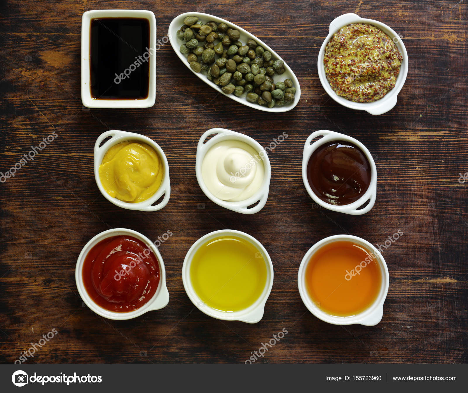 Types Of Sauces
 Different types of sauces and oils in bowls top view
