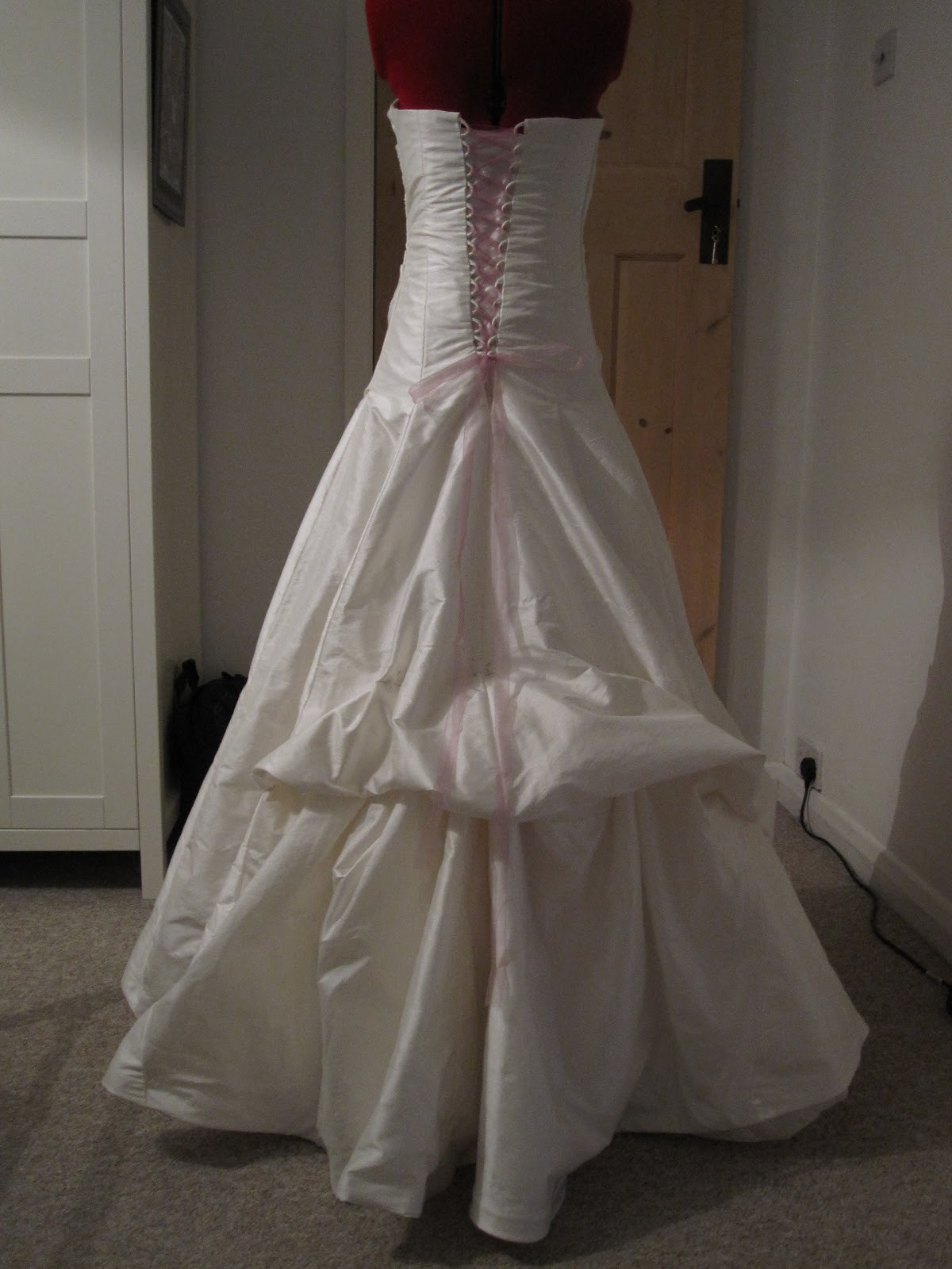 Wedding Gown Bustle
 Queen of Darts hustle and bustle the hem of the