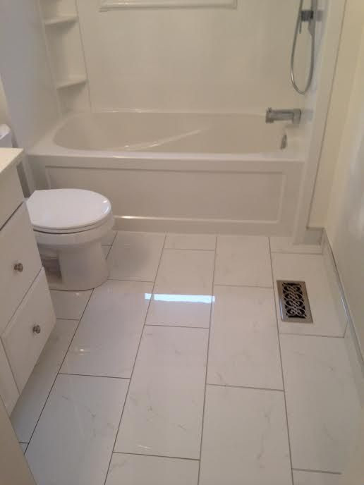12X24 Tile In Small Bathroom
 12″ x 24″ ceramic tile for the floor White cabinet tub