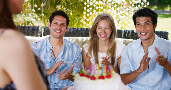 Birthday Party Entertainment Ideas For Adults
 Friends with cake at birthday party