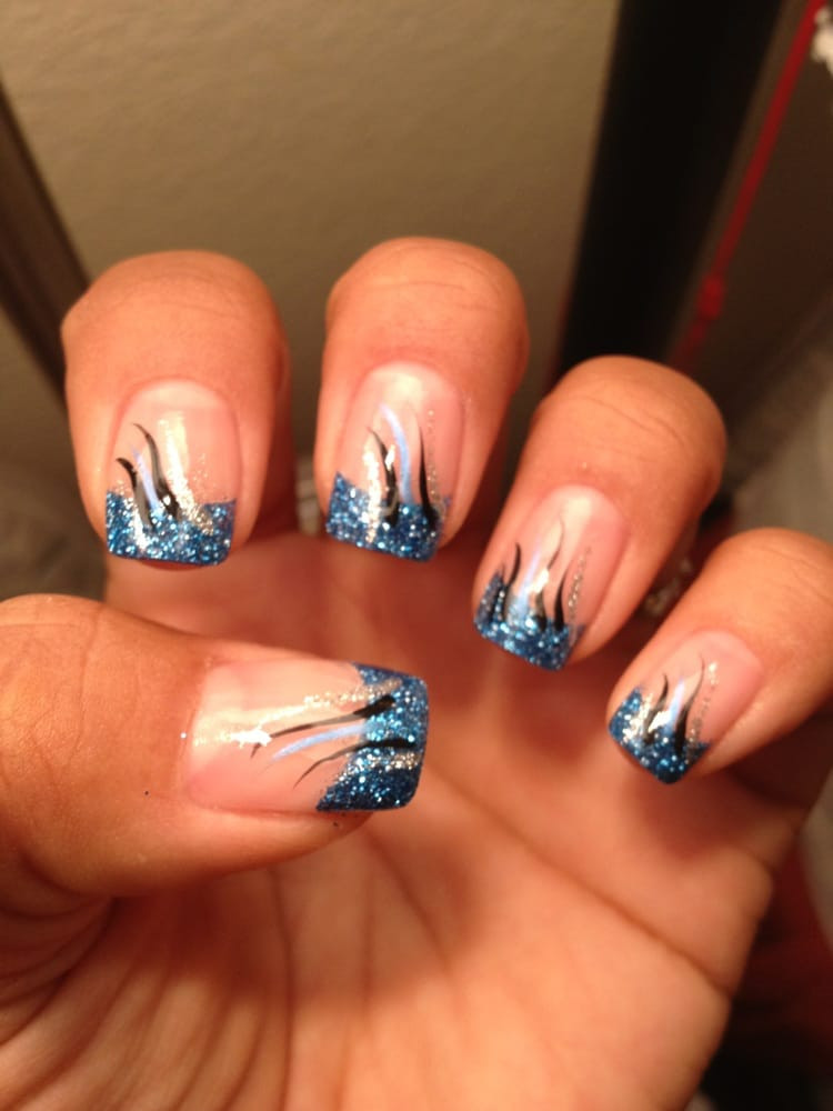 Blue Glitter Acrylic Nails
 Acrylic nails with metallic glitter blue Added black