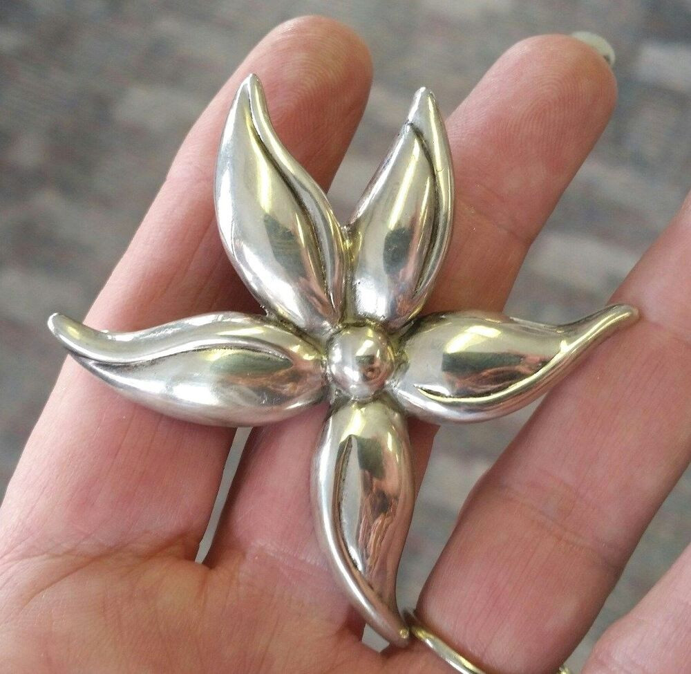 Brooches Modern
 Designer signed A Sterling Silver Modern Flower Power Pin