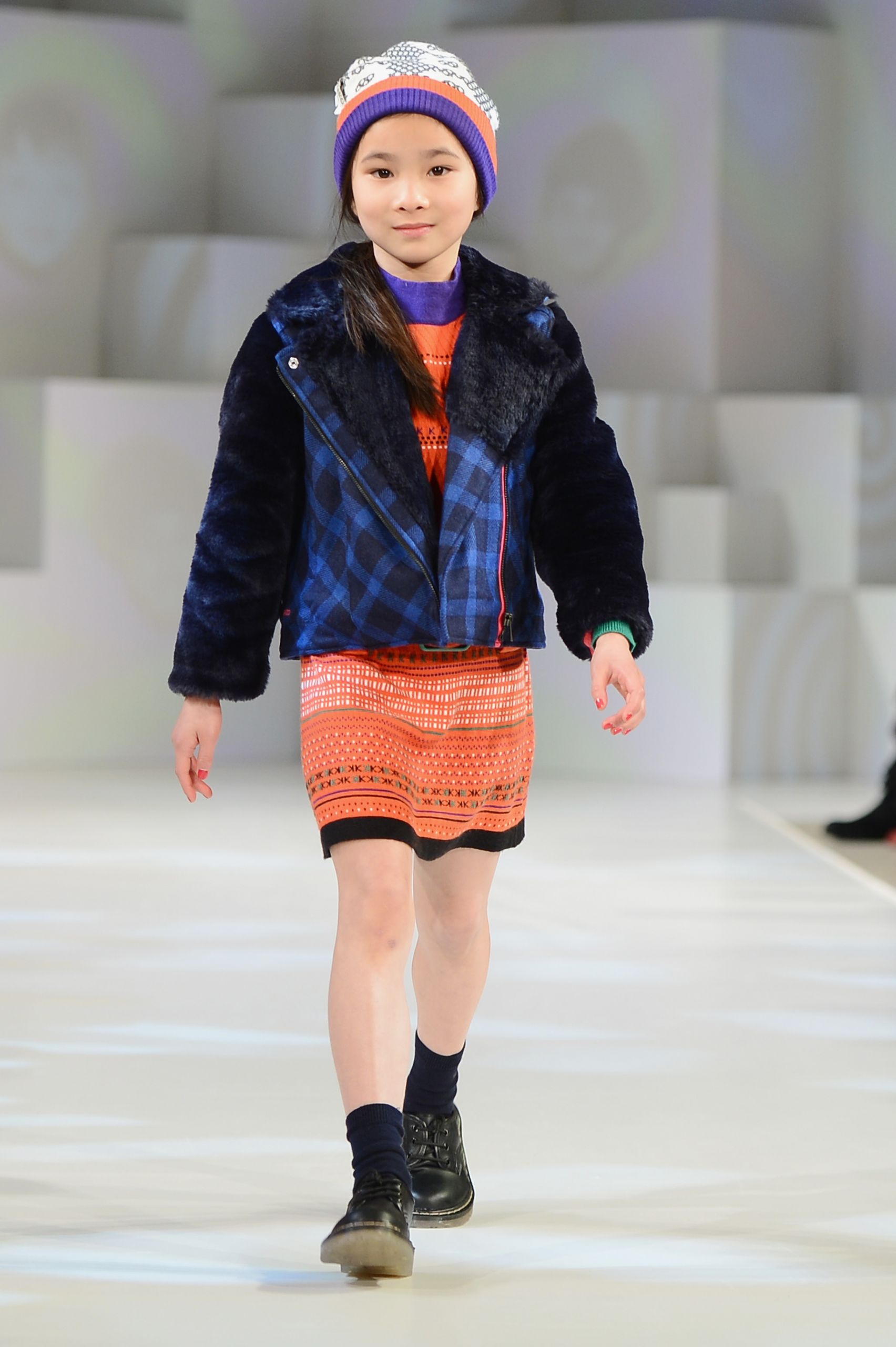 Children Fashion Model
 A model wearing Kenzo Look 1 AutumnWinter 13 walks the