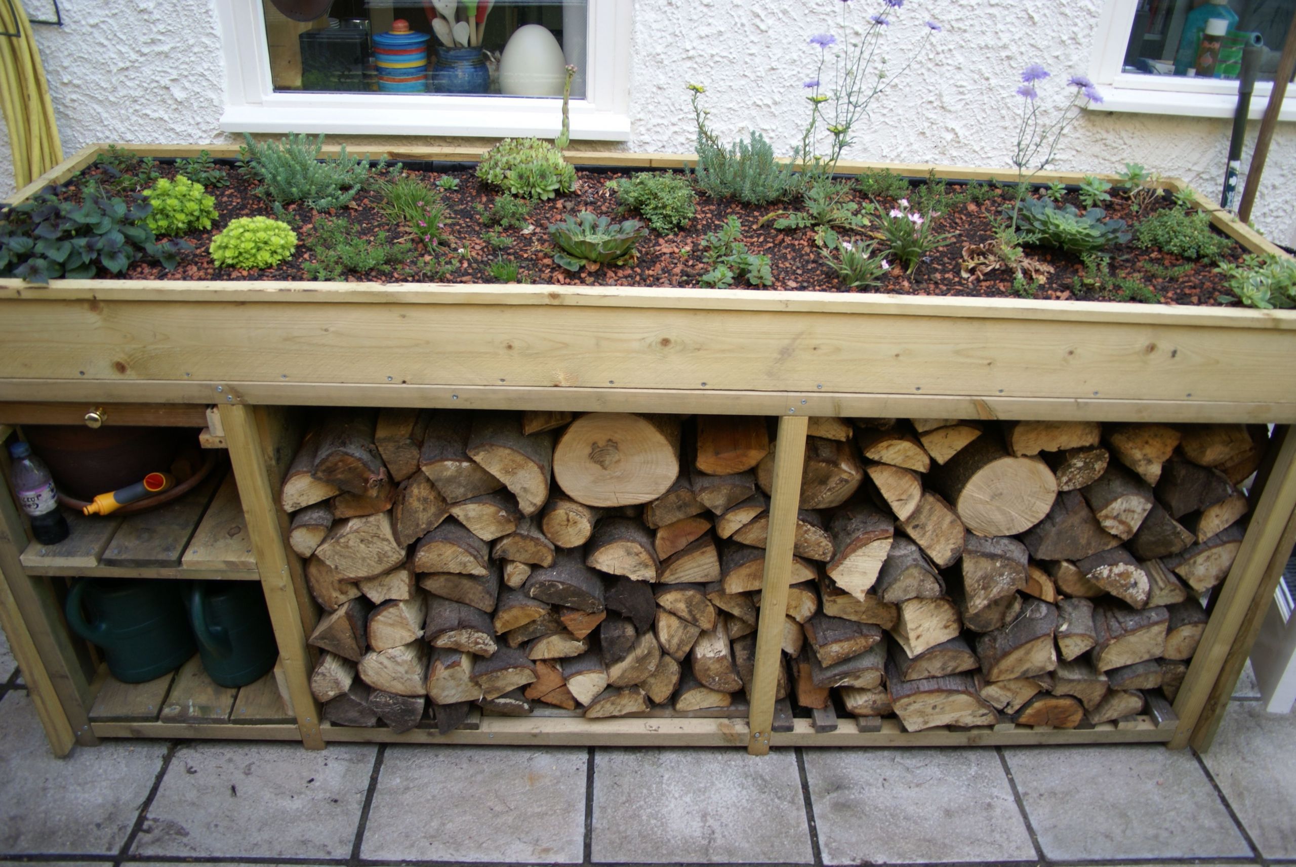 DIY Firewood Rack With Roof
 log store with green roof Google Search