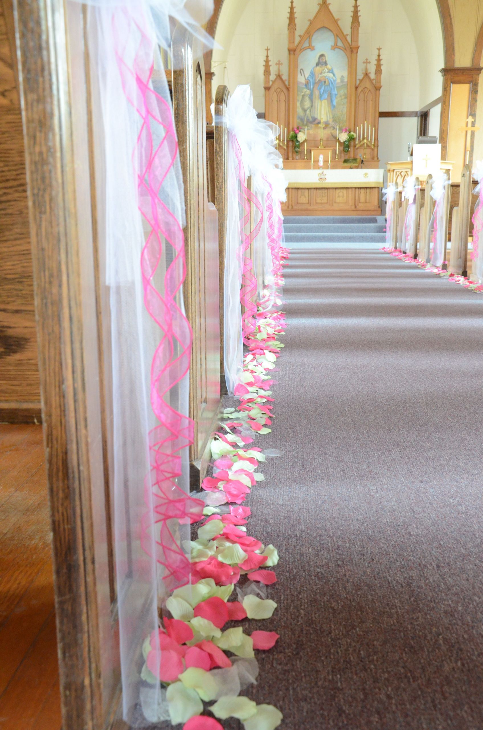 DIY Pew Decorations
 pew bows and petals along the aisle