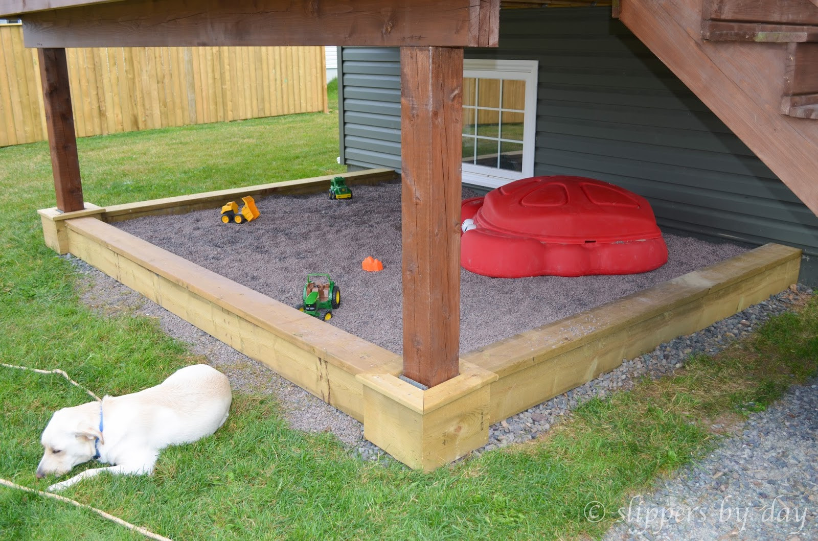 DIY Sand Box
 Slippers by Day DIY Sandbox Beneath a Raised Deck