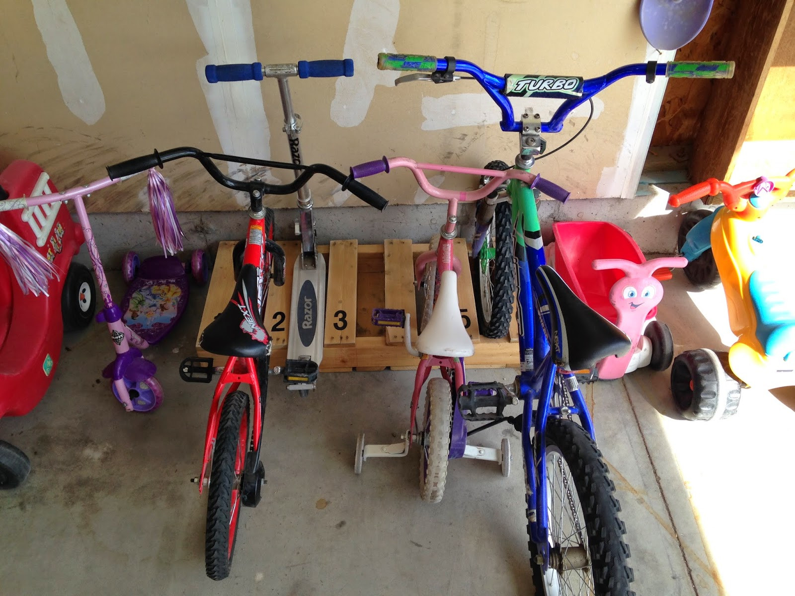 DIY Scooter Rack
 These 18 Easy Tricks Will Have Your Garage Organized in No