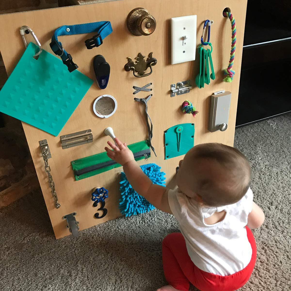 DIY Toddler Busy Board
 Build a Toddler Busy Board with Items You Already Have