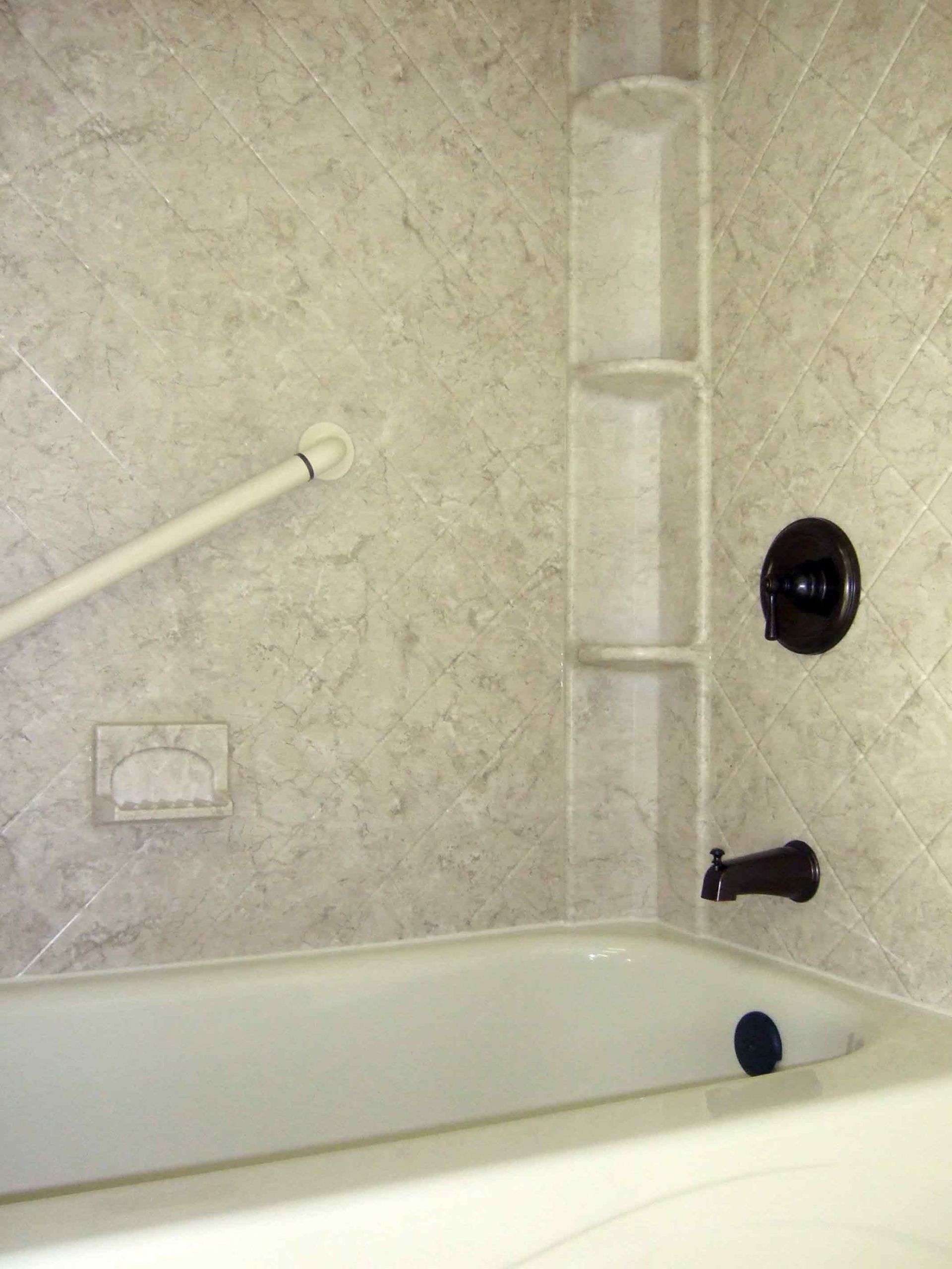 Fiberglass Bathroom Wall Panels
 Acrylic shower walls with Breccia pattern and shower caddy