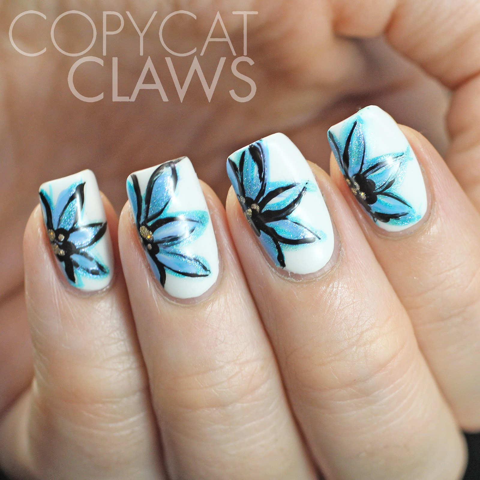 Freehand Nail Art
 Copycat Claws Freehand Blue Flower Nail Art