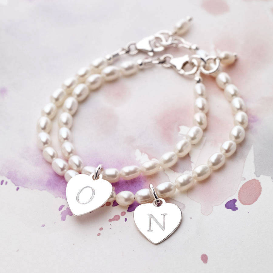 Girls Charm Bracelet
 girls personalised silver charm and hope pearl bracelet by