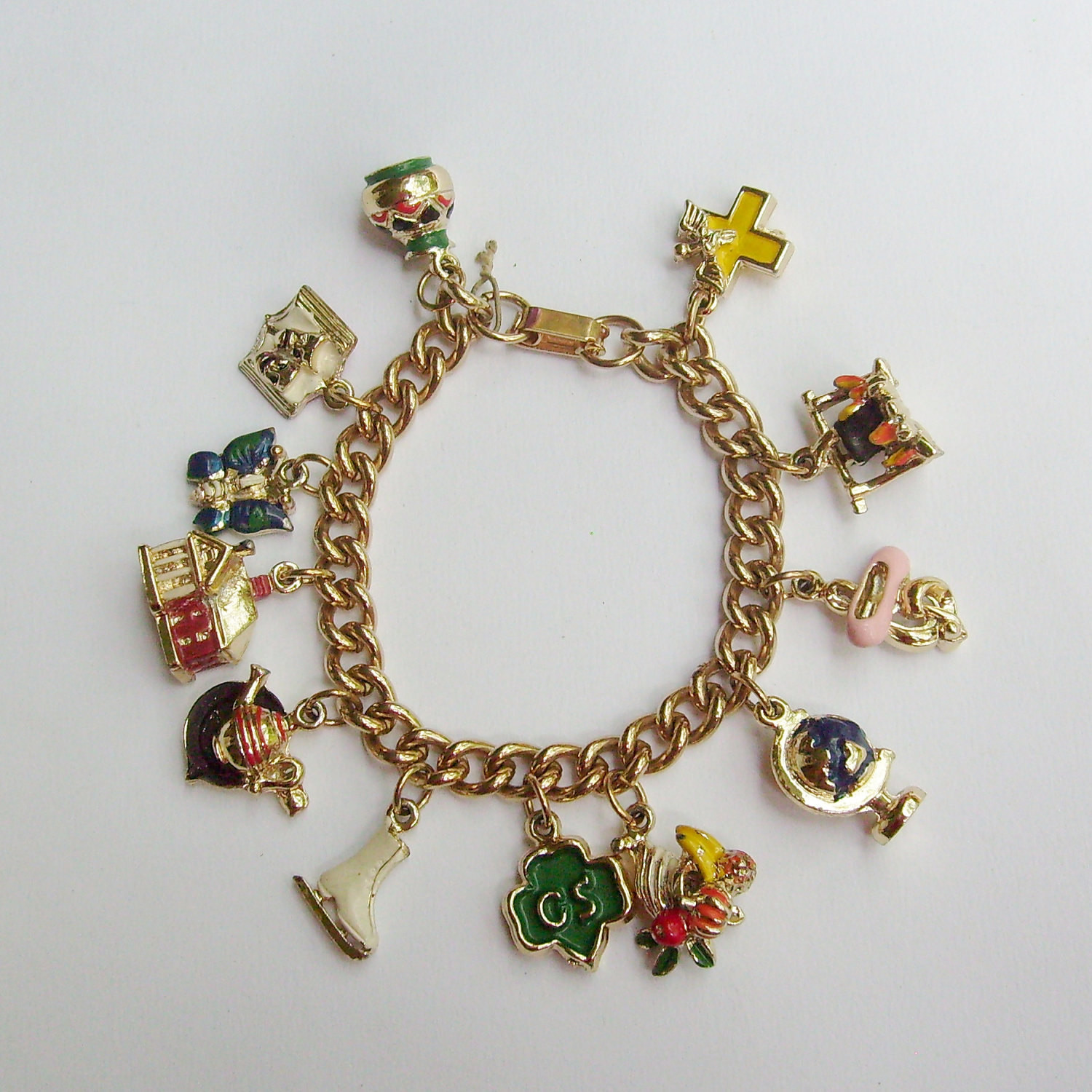 Girls Charm Bracelet
 Vintage Girl Scouts charm bracelet gold with 12 3D enamel