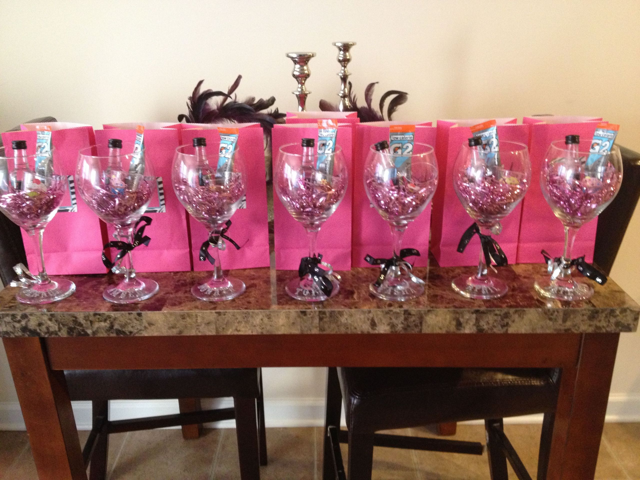 Girls Weekend Gift Ideas
 Girls Trip Gifts A wine glass with shot bottles and a