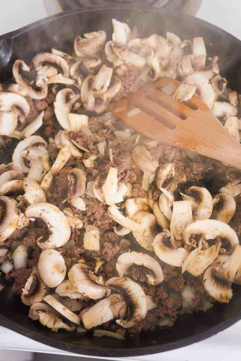 Ground Beef Mushroom
 sliced mushrooms in skillet with ground beef