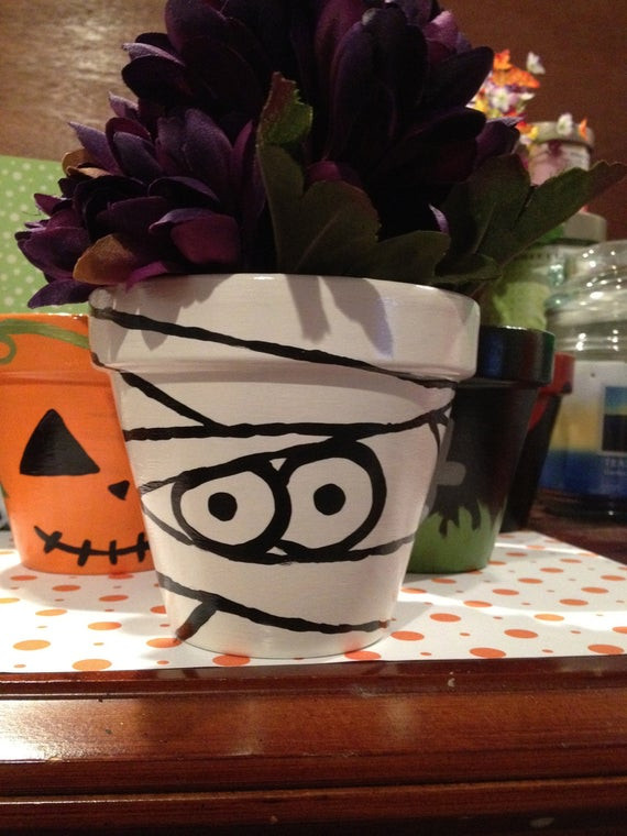Halloween Flower Pots
 Items similar to Cute Mummy Painted Pot Halloween on Etsy