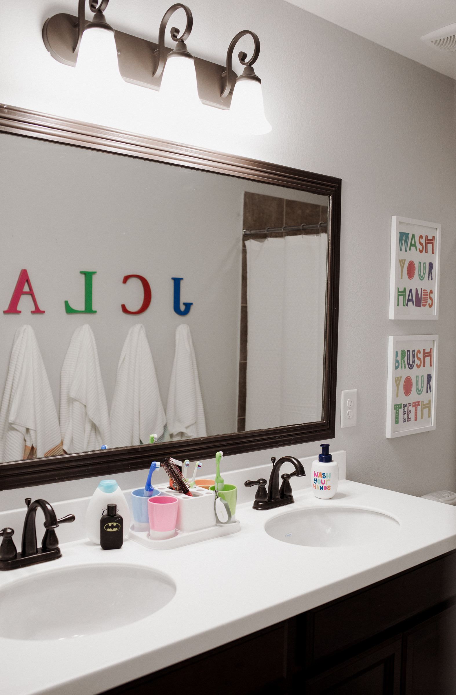Kids Bathroom Accessories
 Our Kids d Bathroom Decor Makeover Uptown with Elly
