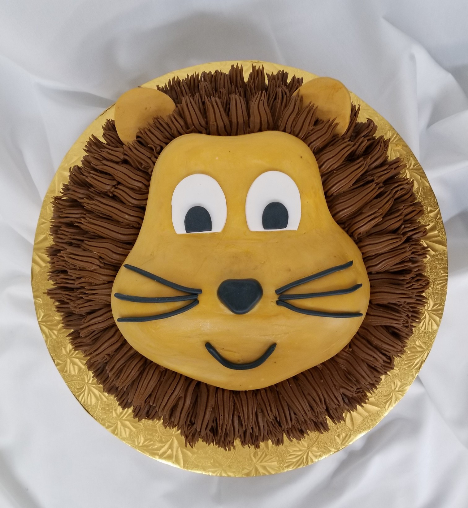Lion Birthday Cake
 Lion s Head celebration cake from Cinotti s Bakery