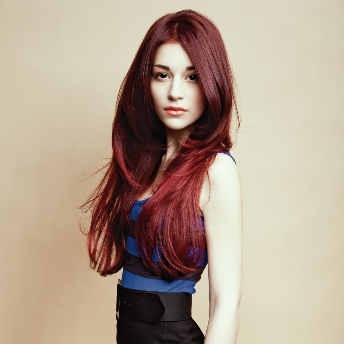 Long Red Hairstyles
 Extra long and layered hairstyle with a dark red haircolor