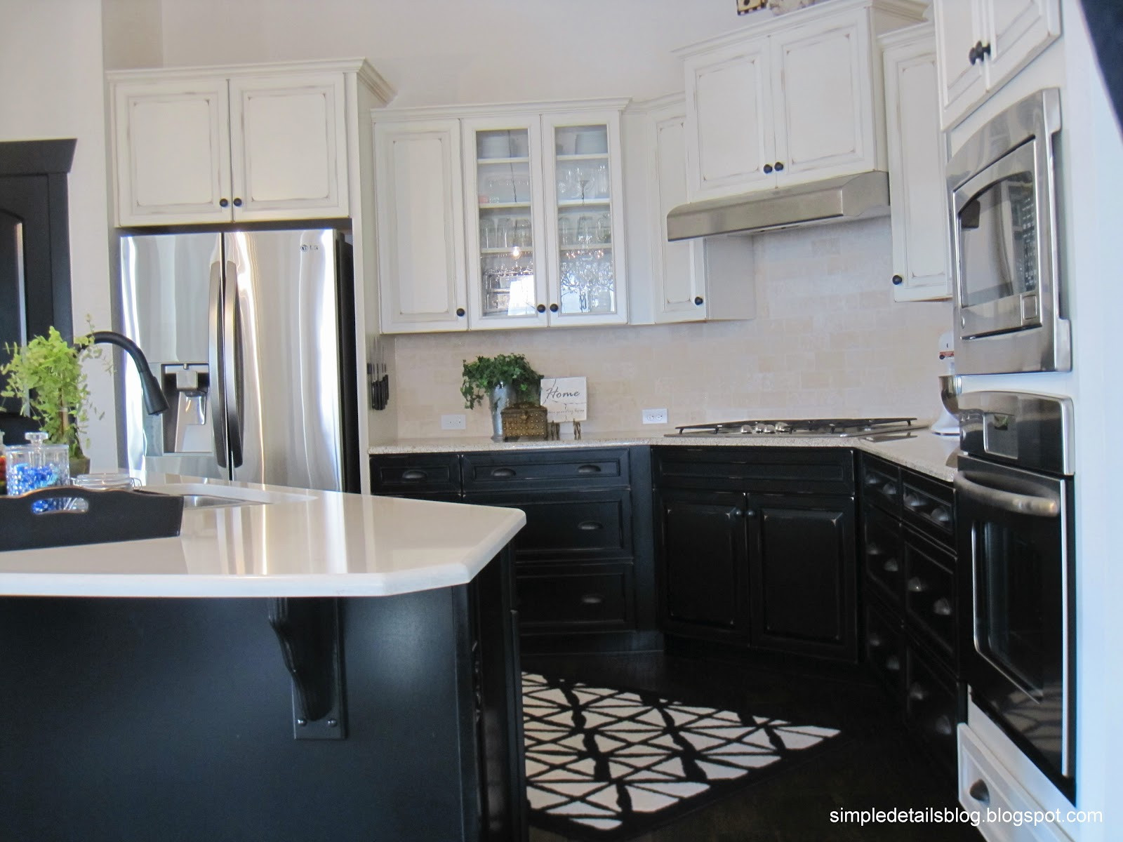 Lowering Kitchen Cabinets
 Simple Details builder beige to black beauty