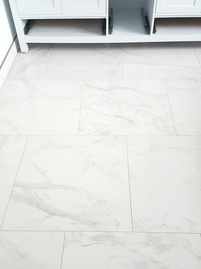 Marble Bathroom Floor Tiles
 Choosing faux Carrara Marble Floor Tile for the Bathroom