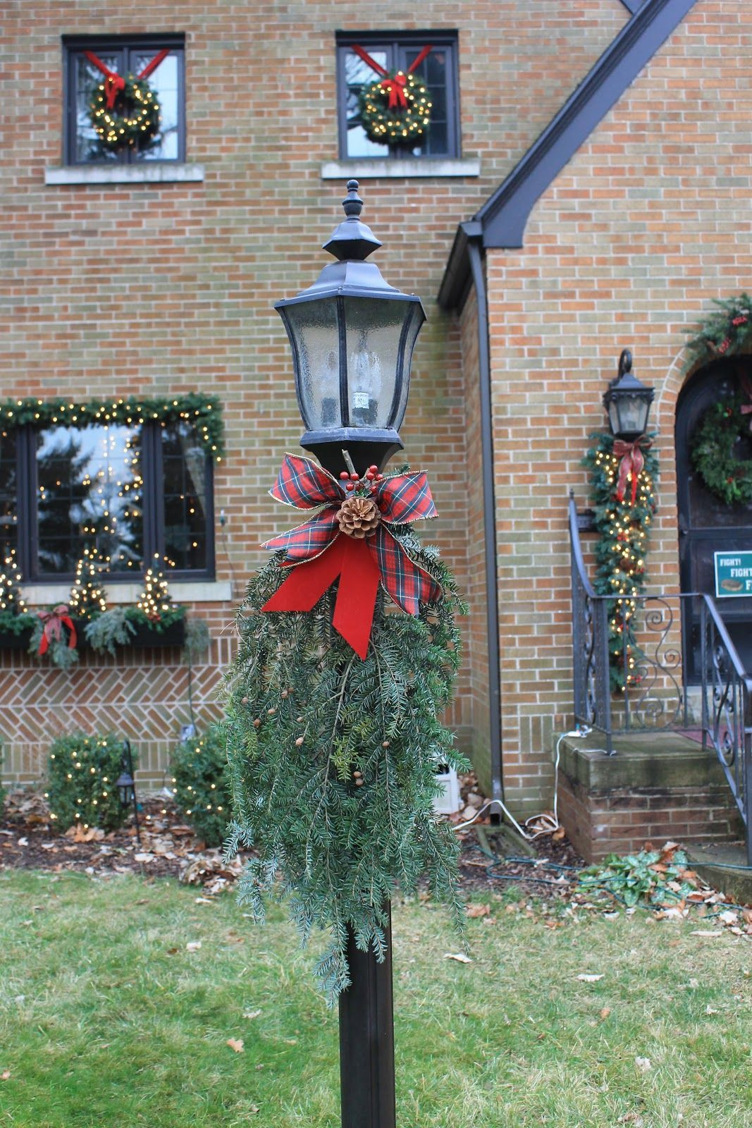 Outdoor Christmas Lamp Post
 Holiday lamp post just a few evergreen sprigs and ribbon