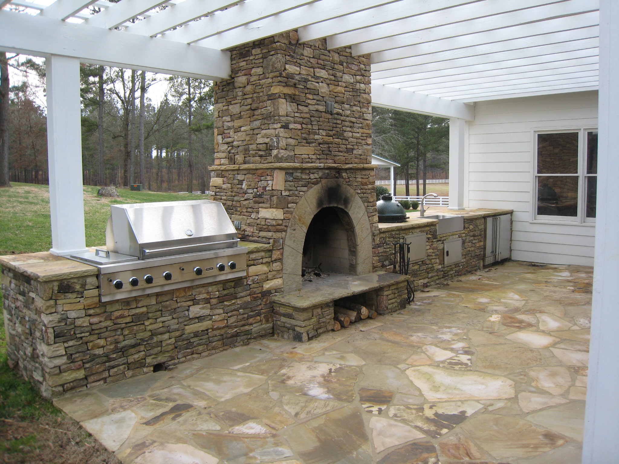 Outdoor Kitchen And Fireplace
 Outdoor Kitchens & Stone BBQ Design