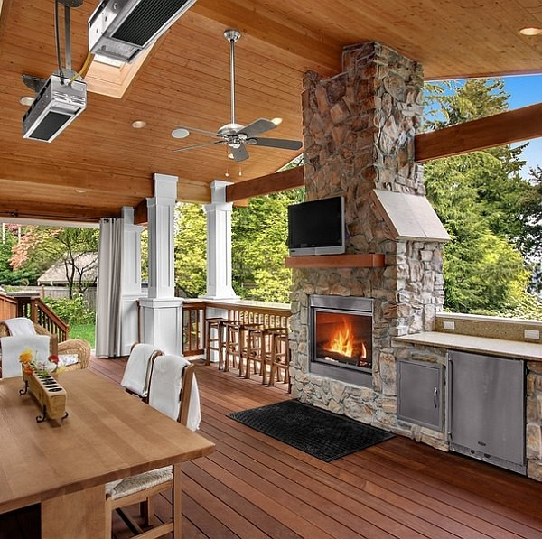 Outdoor Kitchens With Fireplace
 Stone fireplace next to the outdoor kitchen and a lovely