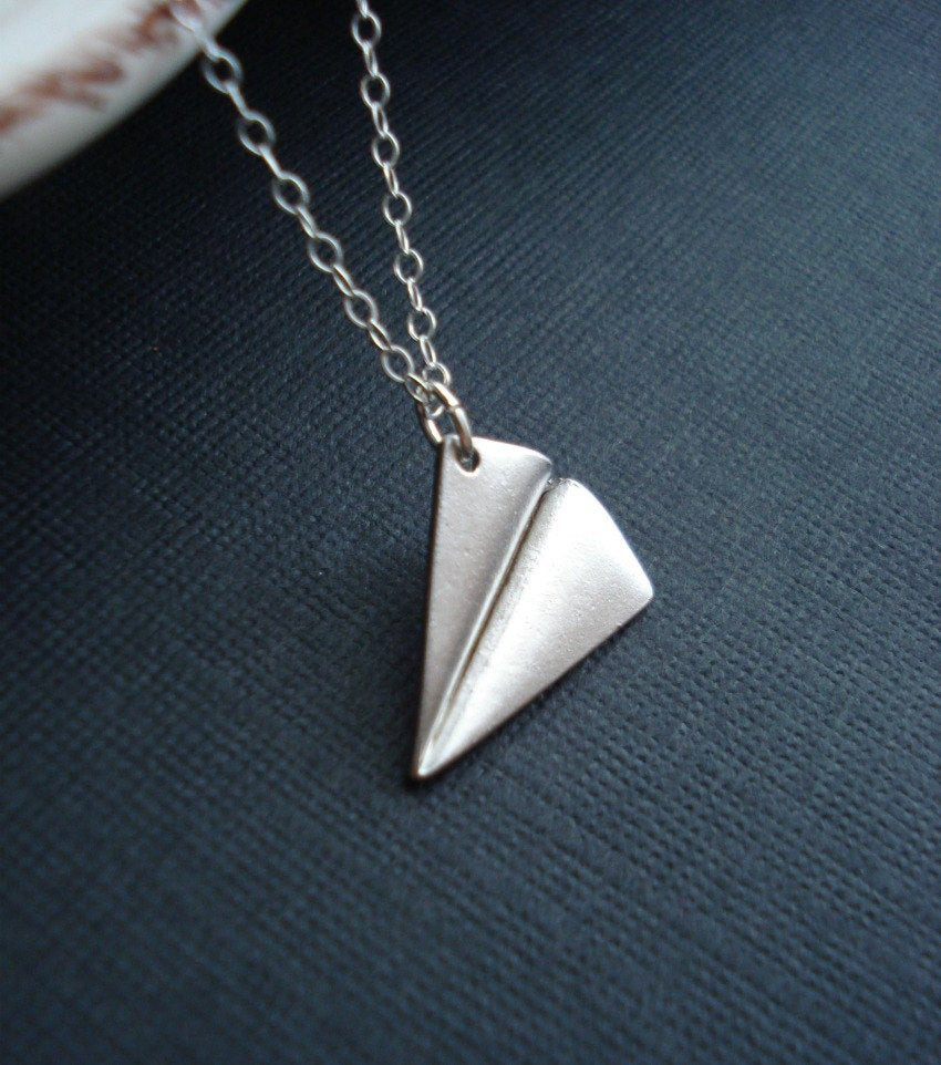 Paper Plane Necklace
 Paper Airplane Necklace In Silver e Direction by