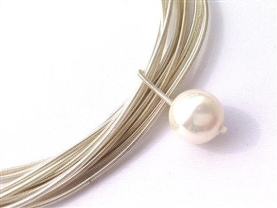Piano Wire Necklace
 Piano Wire Necklace with white pearl