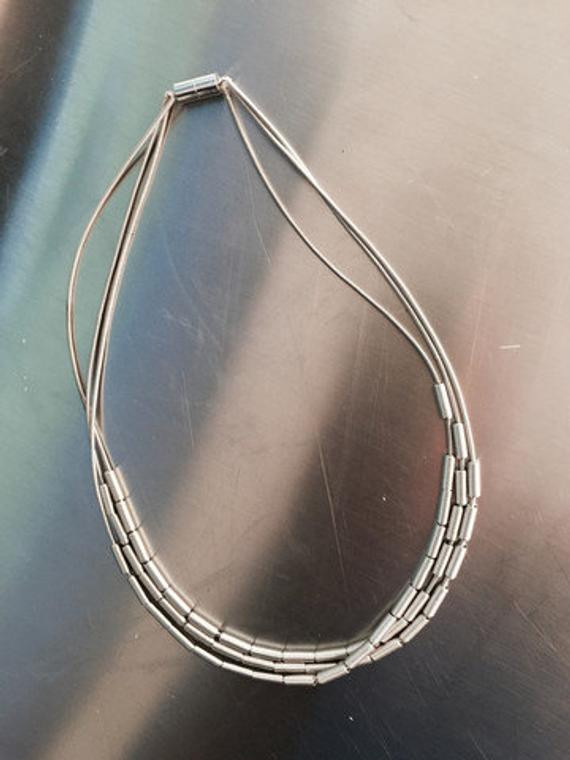 Piano Wire Necklace
 Piano Wire Necklace Silver with silver dashes by Cre8tvqn