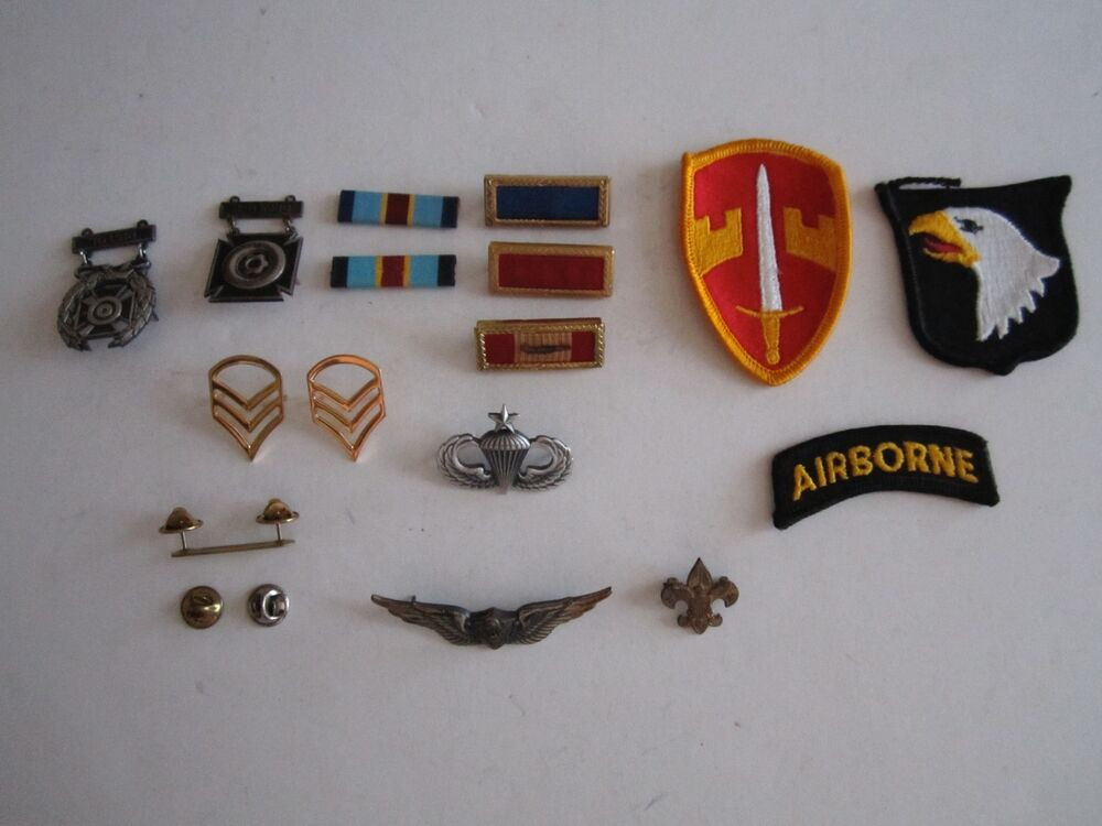 Pins And Patches
 LOT OF VINTAGE MILITARY PINS RIBBONS AND PATCHES NICE