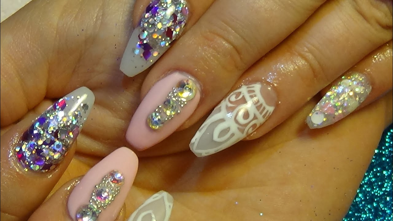 Pretty Glitter Nails
 beautiful pink & glitter acrylic nails with hand painted