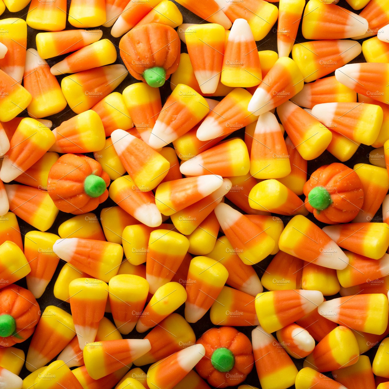 Pumpkin Candy Corn
 Candy corn and pumpkin Halloween background Food & Drink