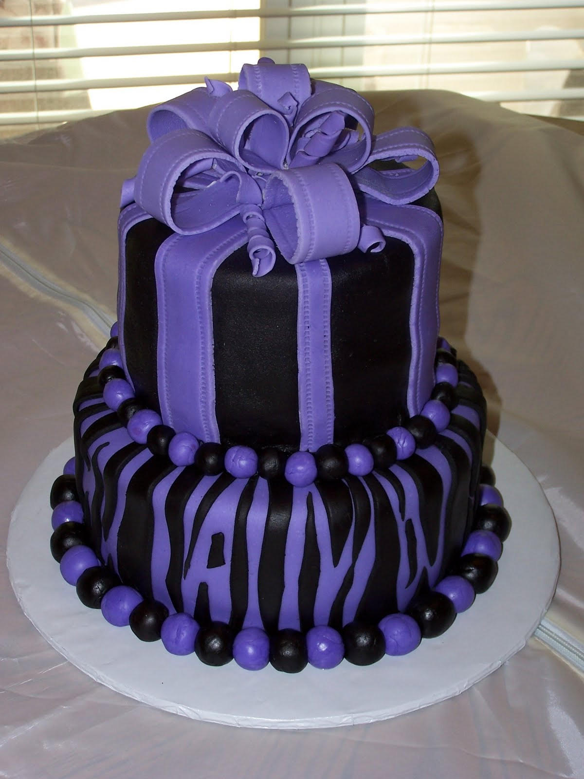 Purple Birthday Cakes
 Heather Calvin Cakes Two tier purple and black birthday cake