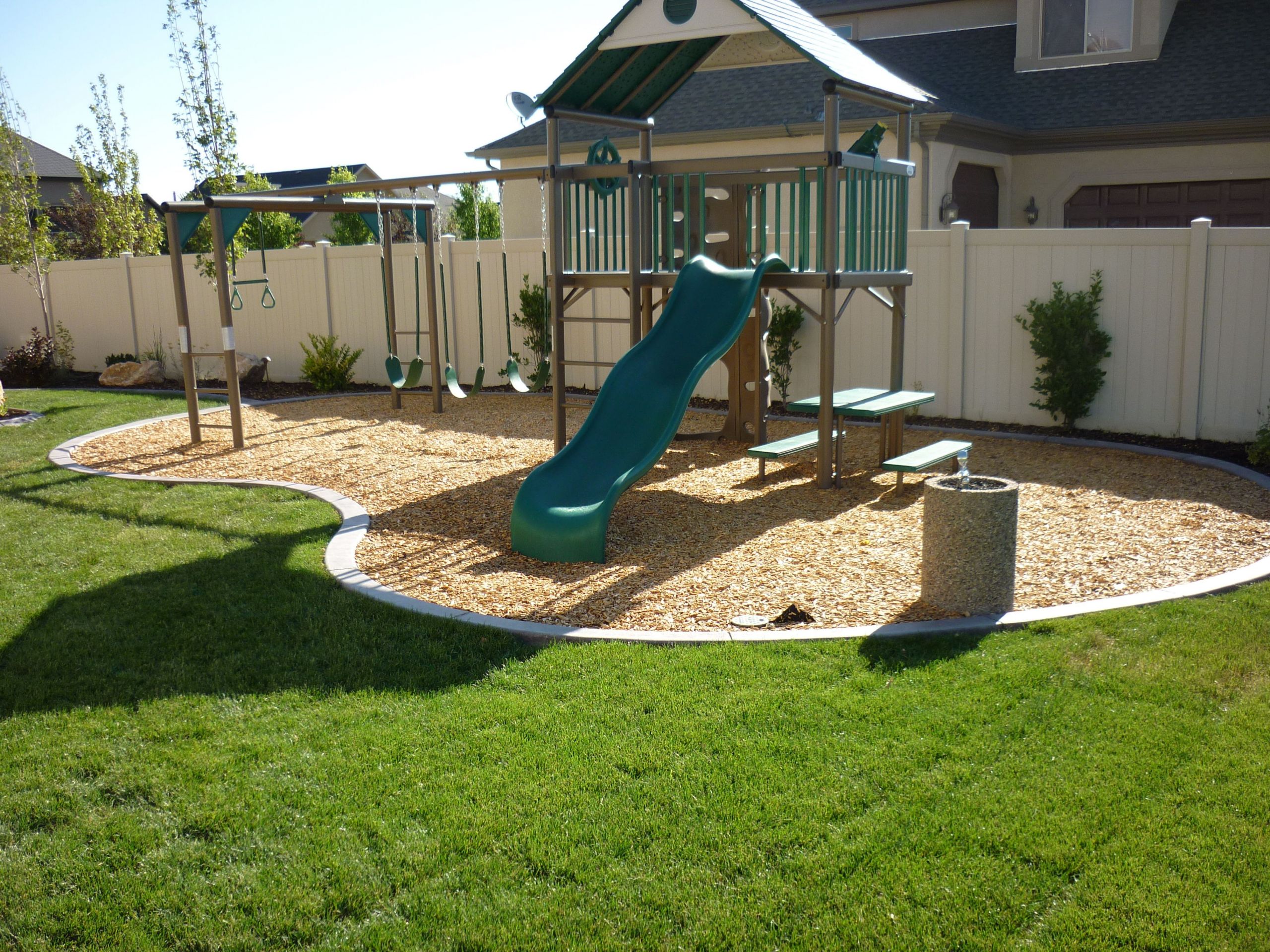 Small Backyard Playground Ideas
 Backyard playground in the landscaping in South Jordan
