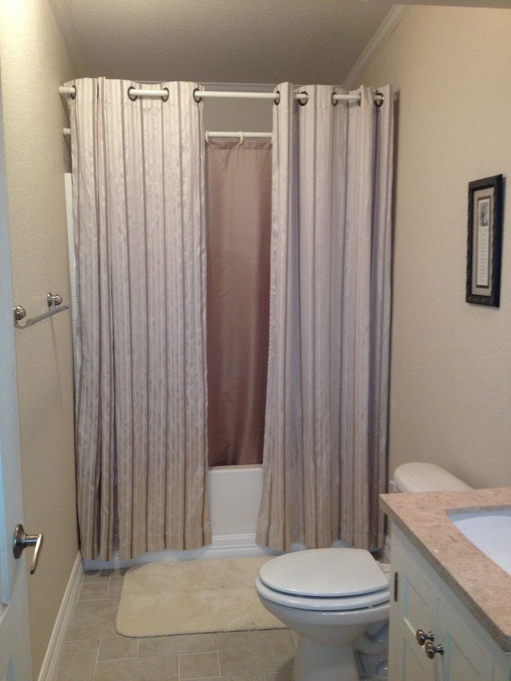 Small Bathroom Curtains
 hanging shower curtains to make small bathroom look bigger