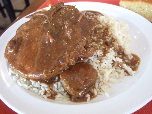 Smothered Pork Chops And Rice
 The Soul of Houston Mikki’s Cafe