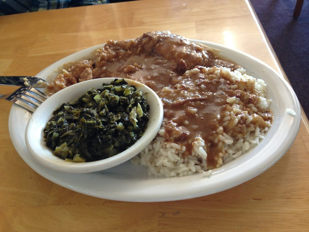 Smothered Pork Chops And Rice
 Smothered pork chop with rice and collard greens Notice