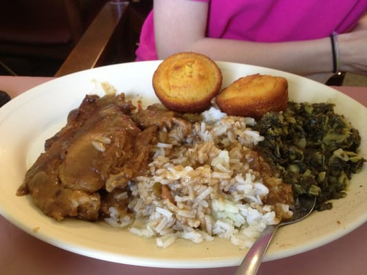 Smothered Pork Chops And Rice
 Smothered pork chops with rice and greens