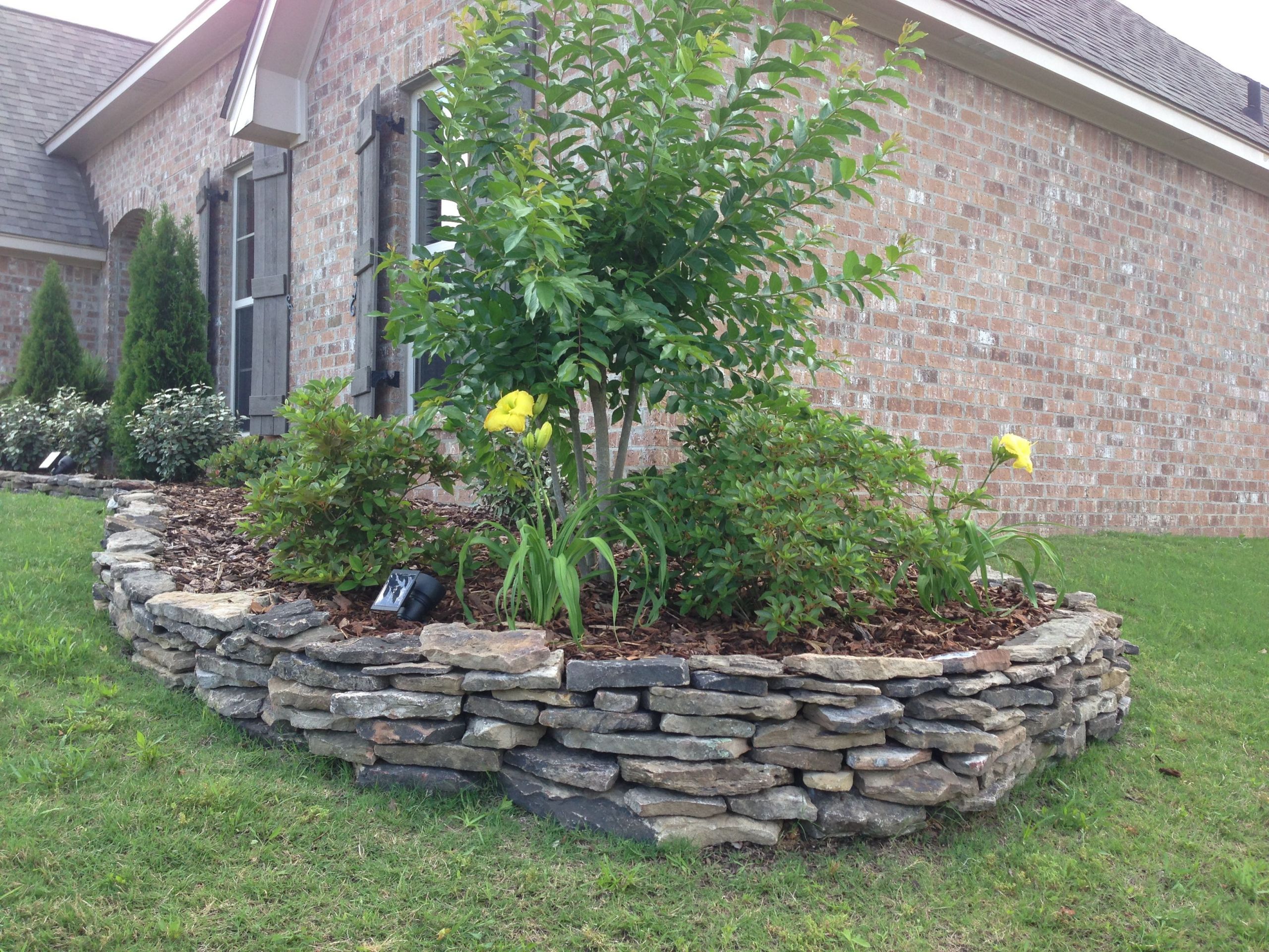 Stacked Stone Landscape Edging
 Stacked my own stone flowerbed border in a couple of hours