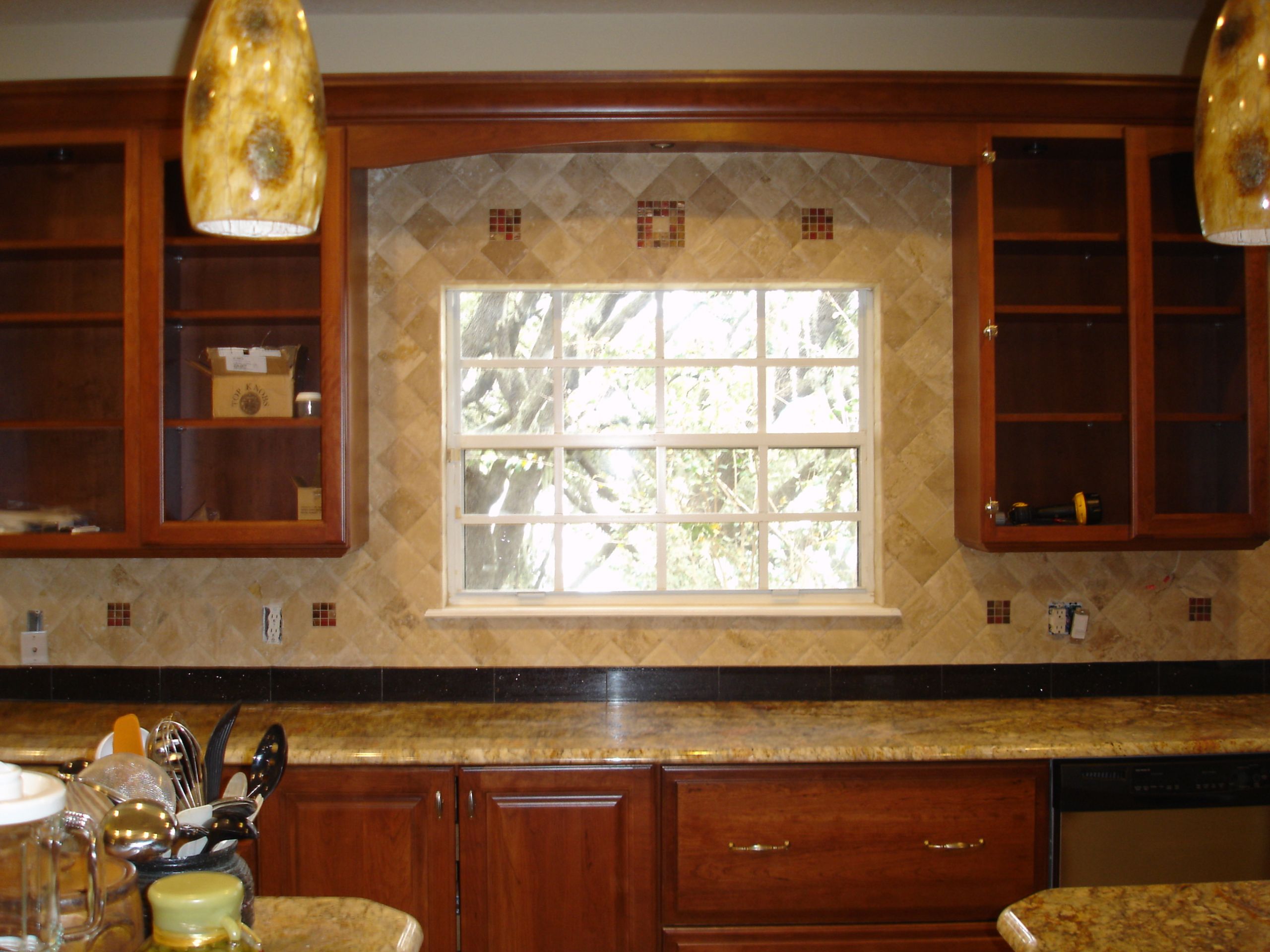 Tile Inserts For Kitchen Backsplash
 Travertine backsplash with decorative glass inserts