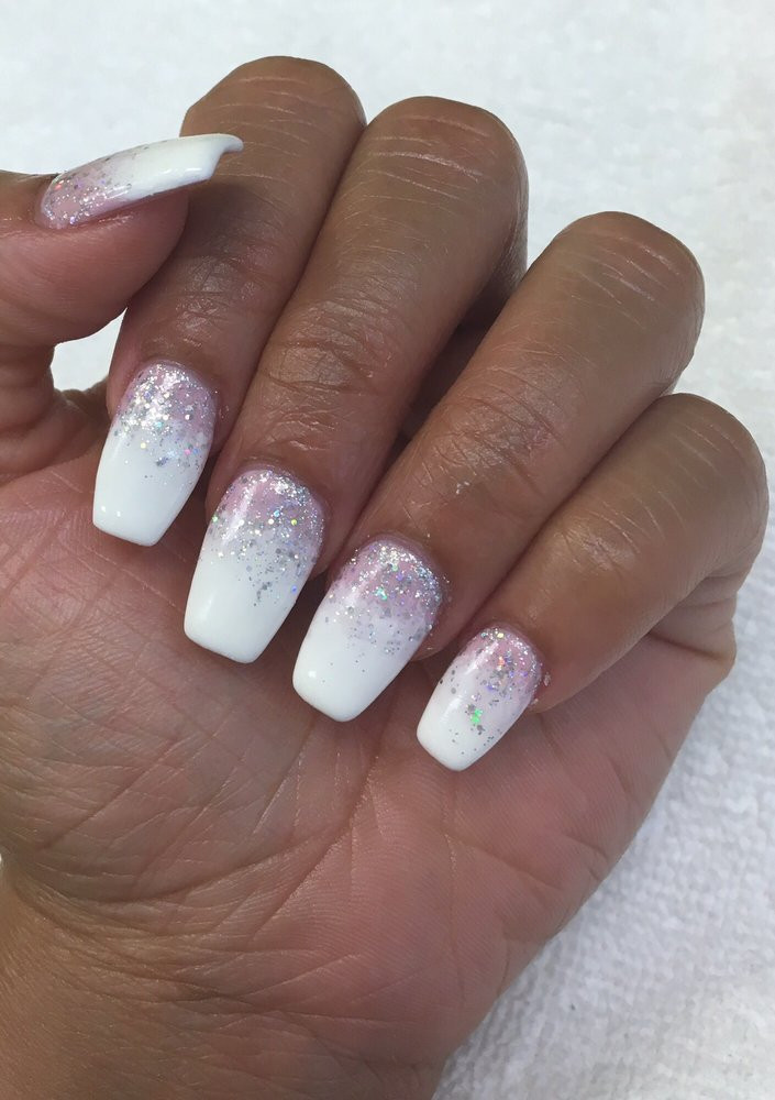 White And Glitter Nails
 Pink and white gel ombré manicure with glitter coffin