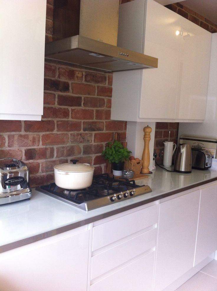 White Brick Kitchen
 Exposed brick kitchen with clean gloss white units