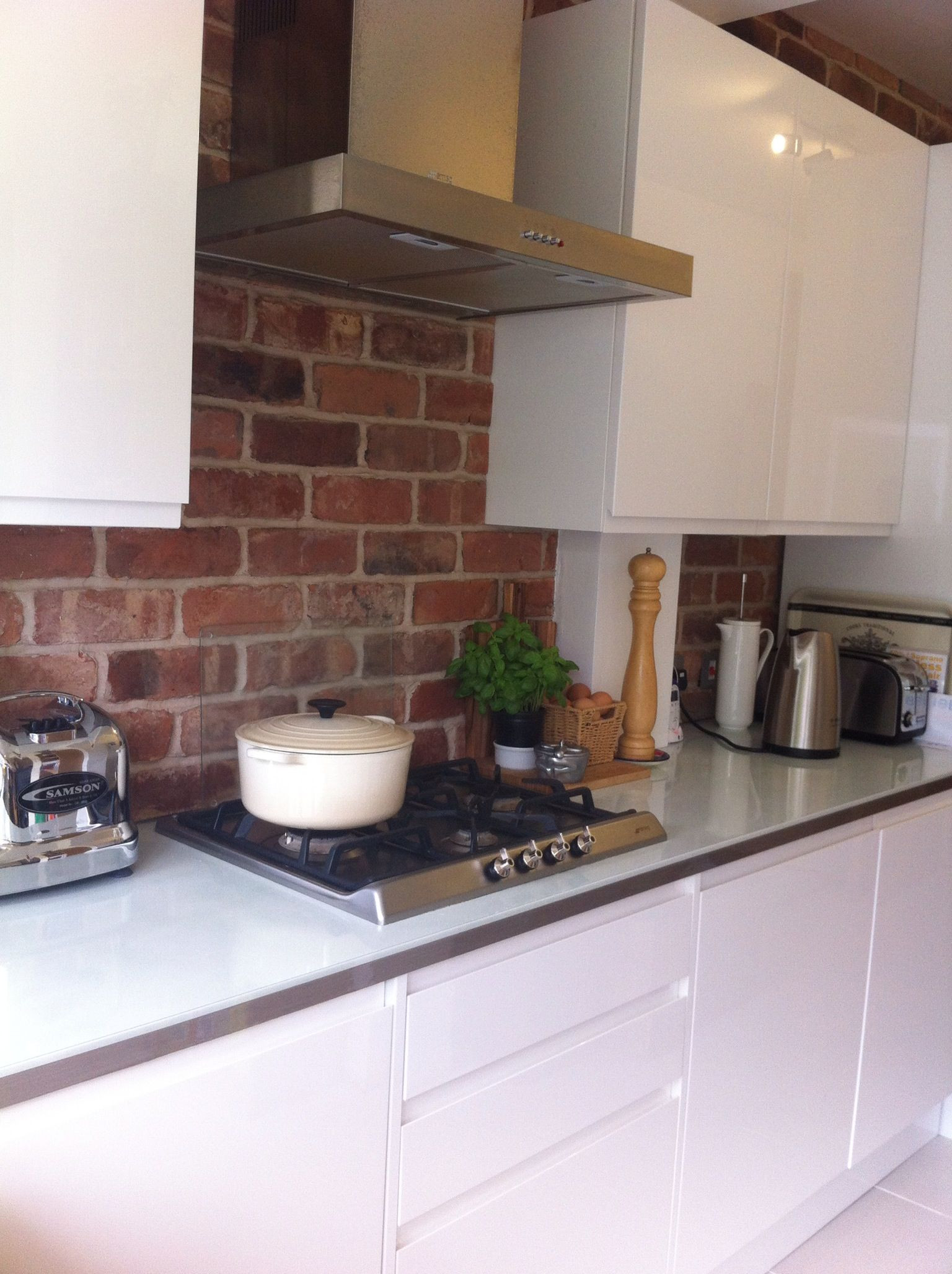 White Bricks Kitchen
 Exposed brick kitchen with clean gloss white units