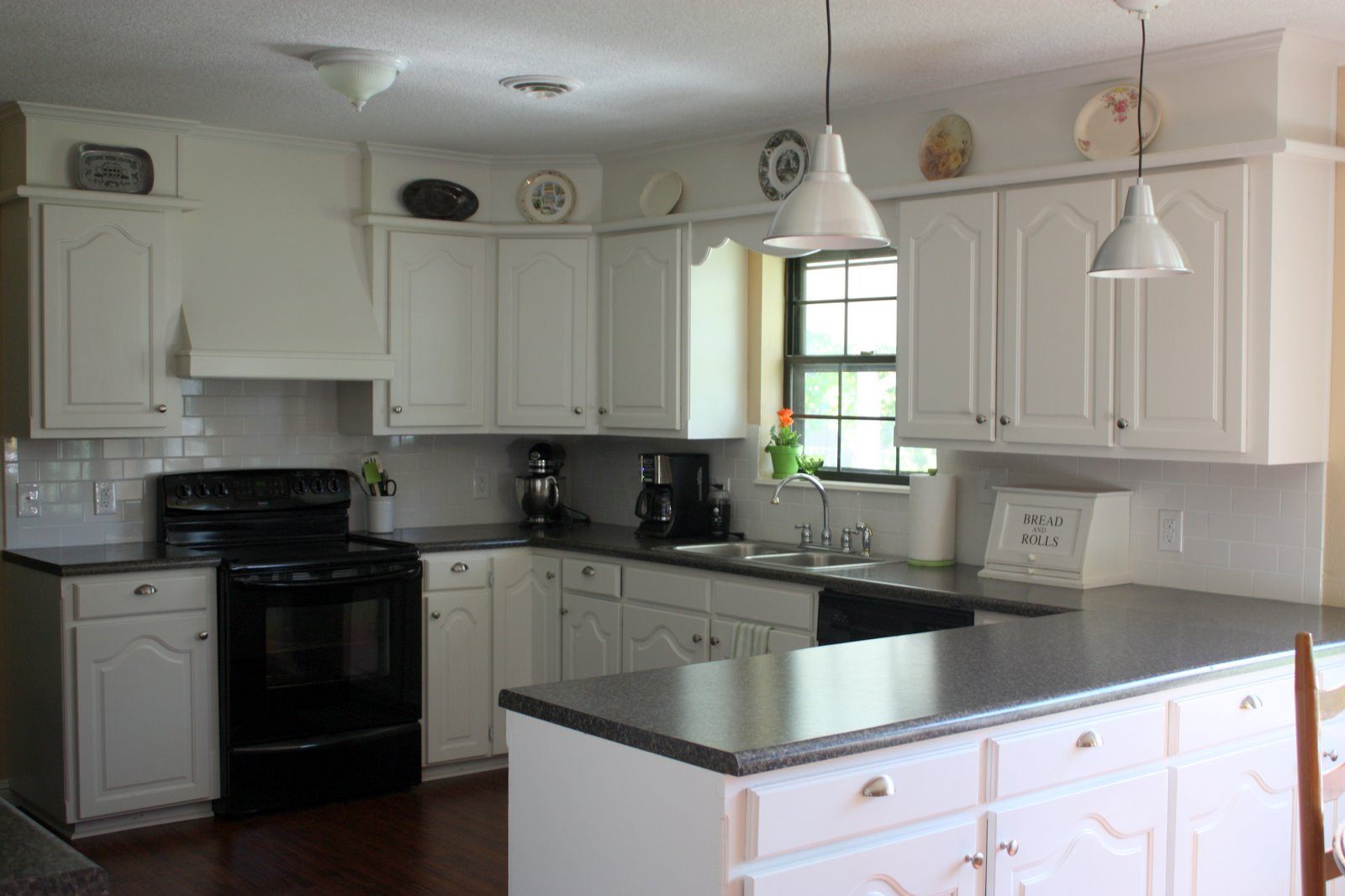 White Kitchen Black Appliances
 Remodelaholic