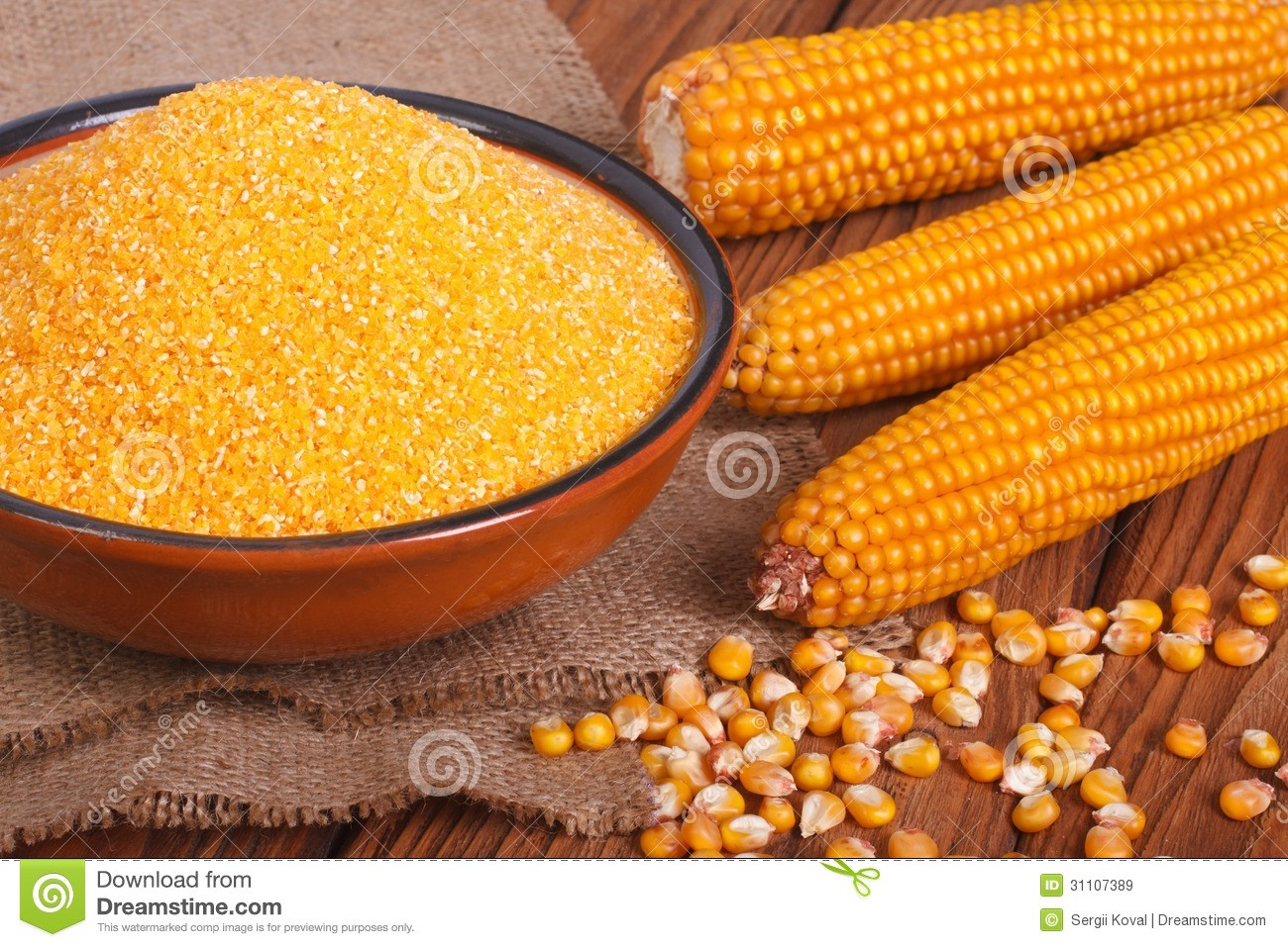 Whole Grain Corn
 Corn Groats In A Bowl Whole Grain And Cob A Wooden
